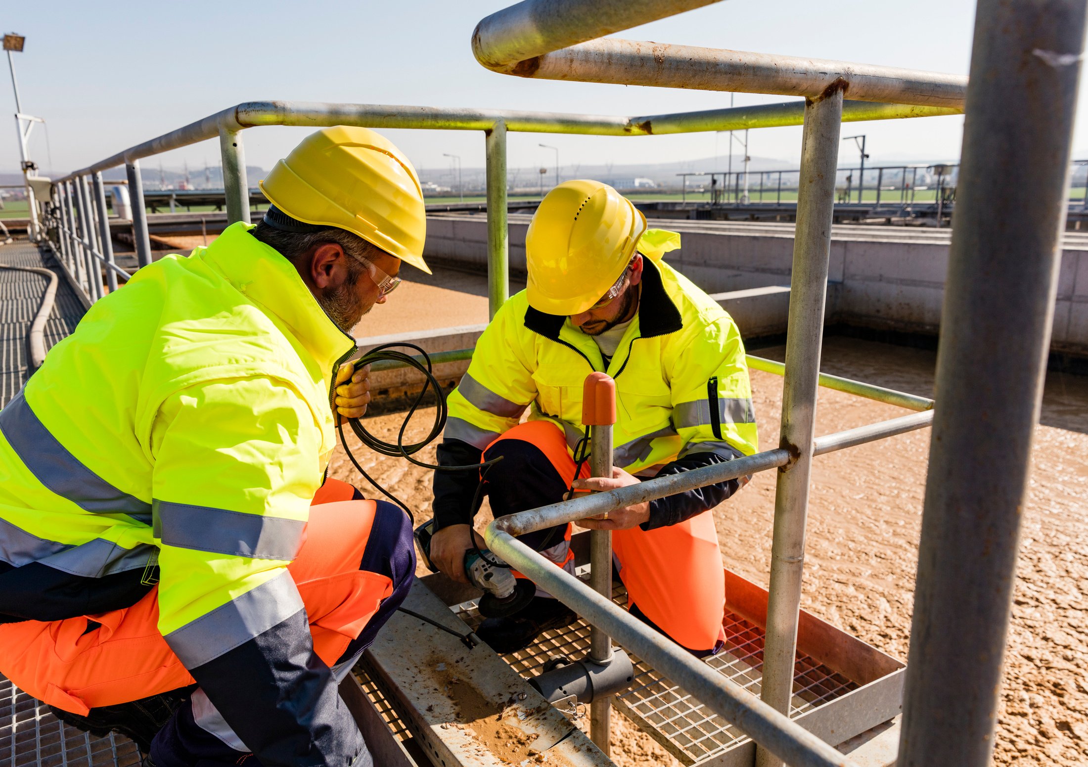 Workers on site of wastewater treatment plant